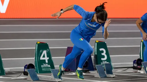 This is an image of sprinter Irene Siragusa taking off from the starting block of a European Athletics race