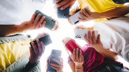 A group of people looking at their phones