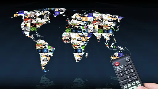 Remote control with virtual multimedia screen in background. World map composition